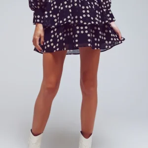 Falda mini con volados en negro y lunares crema