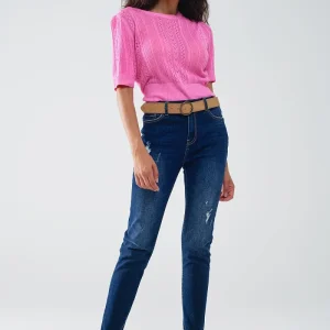 Vaqueros super ajustados desgastados en denim elástico con lavado oscuro